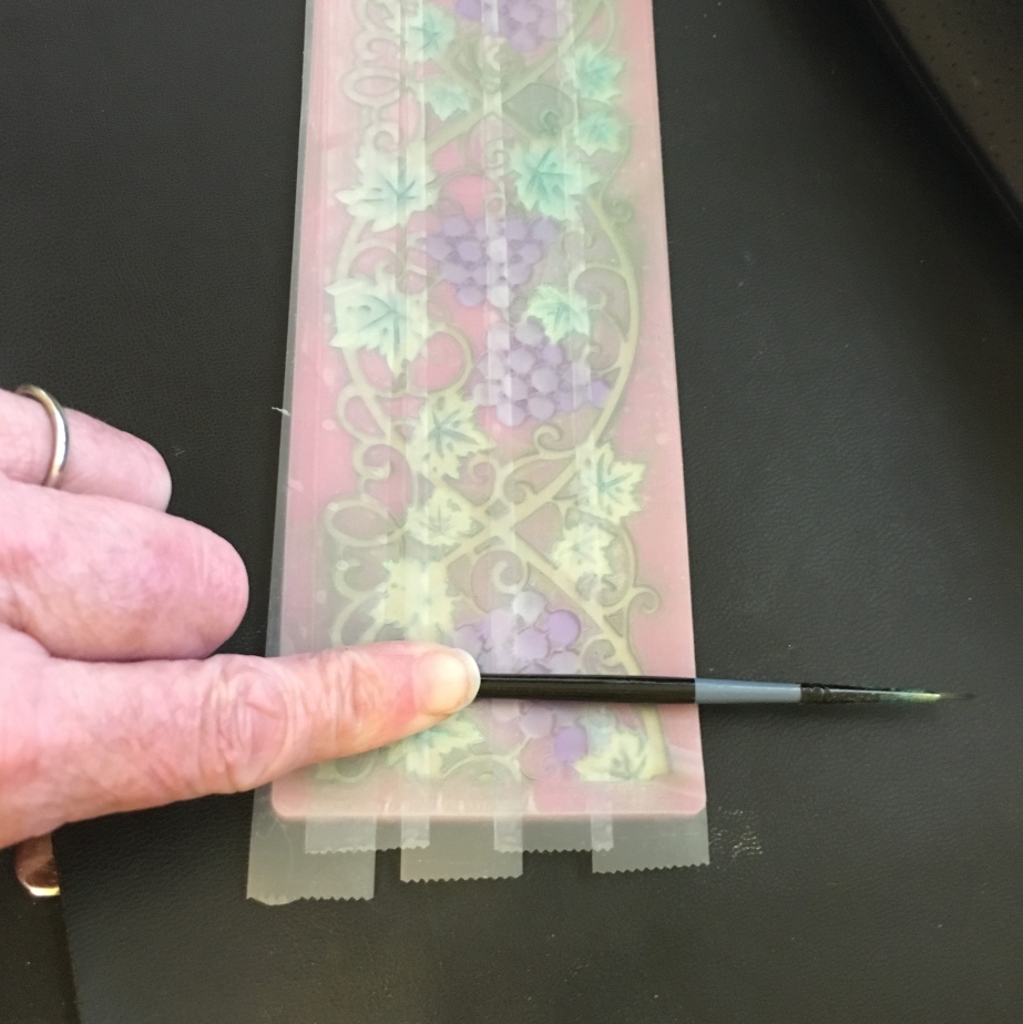 rubbing tape to pull off excess mica on top